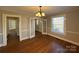 Elegant dining room featuring hardwood floors and chandelier at 330 E Main St, Albemarle, NC 28001