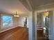 Hardwood floors and chandelier highlight this dining room at 330 E Main St, Albemarle, NC 28001