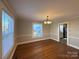 Dining room with hardwood floors and view into kitchen at 330 E Main St, Albemarle, NC 28001