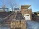 Stone house exterior with a detached garage and steps leading up to the entrance at 330 E Main St, Albemarle, NC 28001