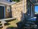 Stone house exterior with a side entrance and stone steps at 330 E Main St, Albemarle, NC 28001