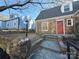 Charming stone home with a red front door, stone steps, and manicured landscaping at 330 E Main St, Albemarle, NC 28001