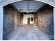 Spacious garage area with stone walls at 330 E Main St, Albemarle, NC 28001