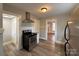 Modern kitchen with stainless steel appliances and view to dining area at 330 E Main St, Albemarle, NC 28001