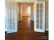 Hardwood floors and white french doors and light filled living space at 330 E Main St, Albemarle, NC 28001