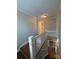 Upstairs hallway with hardwood floors and white railing at 330 E Main St, Albemarle, NC 28001