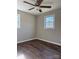 Spacious bedroom with hardwood floors and two windows at 3730 Sedgefield Dr, Conover, NC 28613