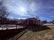 Backyard view showing a rectangular pool, wooden deck, and partially visible home at 3730 Sedgefield Dr, Conover, NC 28613