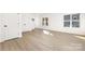 Spacious bedroom with light wood laminate flooring and large windows at 3739 Kennedy Rd, Gastonia, NC 28056