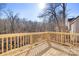 Wooden deck overlooking a wooded area, providing a peaceful outdoor space at 3739 Kennedy Rd, Gastonia, NC 28056