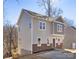 Two-story house with gray siding, brick accents, and a green door at 3739 Kennedy Rd, Gastonia, NC 28056