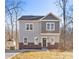 Two-story house with gray siding, brick accents, and a green door at 3739 Kennedy Rd, Gastonia, NC 28056