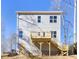 Two story home with rear deck and stairs leading to the yard at 3739 Kennedy Rd, Gastonia, NC 28056