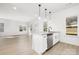 Modern kitchen with island, white cabinets, and stainless steel appliances at 3739 Kennedy Rd, Gastonia, NC 28056