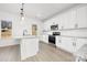 Modern kitchen with white cabinets, granite countertops, and stainless steel appliances at 3739 Kennedy Rd, Gastonia, NC 28056