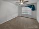 Bright bedroom with neutral walls, carpet flooring, and teal curtains at 3758 Yorkshire Pl, Terrell, NC 28682