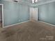 Spacious bedroom with neutral carpeting and light blue walls at 3758 Yorkshire Pl, Terrell, NC 28682