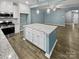 Kitchen island with granite countertop and white cabinets at 3758 Yorkshire Pl, Terrell, NC 28682