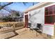 Cozy back deck featuring a wood railing and two metal chairs at 413 W 5Th Ave, Gastonia, NC 28052