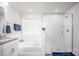 Bathroom showcasing a modern shower, soaking tub, and elegant white tile design at 4134 Steel Way, Sherrills Ford, NC 28673