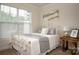 Cozy bedroom with a metal bed frame and window at 4134 Steel Way, Sherrills Ford, NC 28673