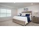 Spacious bedroom with large bed, nightstand, and window blinds at 4134 Steel Way, Sherrills Ford, NC 28673