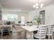 Bright dining area with table and chairs, open to the living room at 4134 Steel Way, Sherrills Ford, NC 28673