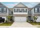 Two-story townhome with gray siding and stone accents at 4134 Steel Way, Sherrills Ford, NC 28673