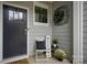 Inviting front porch with a dark gray door and welcoming decor at 4134 Steel Way, Sherrills Ford, NC 28673