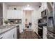 Modern kitchen with white cabinets, granite counters, and a walk-in pantry at 4134 Steel Way, Sherrills Ford, NC 28673