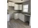 Kitchen area featuring white cabinets, granite countertops and stainless steel sink at 4262 Williamson Rd, Rock Hill, SC 29730