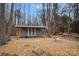 Outdoor shed with patio and a cozy fire pit, perfect for gatherings in the landscaped backyard at 4747 Kenneths Dr, Maiden, NC 28650