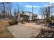 Landscaped patio with outdoor kitchen featuring a grill, stone fireplace and seating area at 4747 Kenneths Dr, Maiden, NC 28650