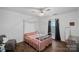 Well-lit bedroom featuring a four-poster bed with soft decor and a comfortable chair at 4747 Kenneths Dr, Maiden, NC 28650