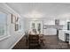 Bright dining room with a wooden table, chairs, and stylish black and white patterned backsplash at 4747 Kenneths Dr, Maiden, NC 28650