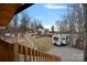 Scenic view of the white farmhouse from the deck, overlooking the fenced in yard and camper at 4747 Kenneths Dr, Maiden, NC 28650