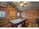 Rustic game room features wood paneled walls, exposed rafters and a pool table at 4747 Kenneths Dr, Maiden, NC 28650