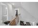 Upstairs hallway leading to various rooms, showcasing hardwood floors and modern railing at 4747 Kenneths Dr, Maiden, NC 28650