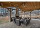 Outdoor patio with fireplace, comfortable seating, and string lights, perfect for entertaining at 4747 Kenneths Dr, Maiden, NC 28650