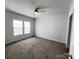 Bedroom with carpet, ceiling fan, and natural light from a dual window setup at 507 E Lackey Farm Rd, Stony Point, NC 28678
