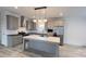 Modern kitchen features a center island, gray cabinets, stainless appliances, and stylish pendant lighting at 507 E Lackey Farm Rd, Stony Point, NC 28678