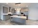 Modern kitchen featuring gray cabinets, stainless steel appliances, and an island with marble countertop at 507 E Lackey Farm Rd, Stony Point, NC 28678