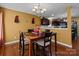 Bright dining room featuring hardwood floors and a view of the kitchen at 5124 Stone Park Dr, Charlotte, NC 28269