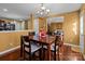 Casual dining area with hardwood floors and kitchen access at 5124 Stone Park Dr, Charlotte, NC 28269