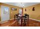 Charming dining area with hardwood floors and a chandelier at 5124 Stone Park Dr, Charlotte, NC 28269