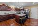 Kitchen with dark wood cabinets, granite counters, and island at 5124 Stone Park Dr, Charlotte, NC 28269