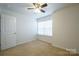 Bright bedroom with ceiling fan and window blinds at 6340 Revolutionary Trl, Charlotte, NC 28217