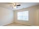 Bright bedroom with ceiling fan and large window at 6340 Revolutionary Trl, Charlotte, NC 28217