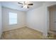 Bright bedroom featuring a ceiling fan and window blinds at 6340 Revolutionary Trl, Charlotte, NC 28217