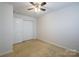 Spacious bedroom with ceiling fan and neutral carpeting at 6340 Revolutionary Trl, Charlotte, NC 28217